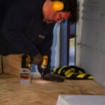 Kris screwing down the plywood.