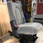 Seat and mount outside the bus.