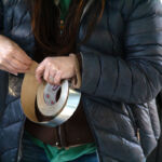Steph peeling off some aluminum tape for the seams.