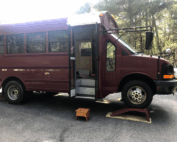 The bus up on ramps.