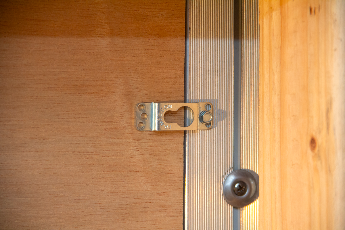 Close up of picture hanger clip.