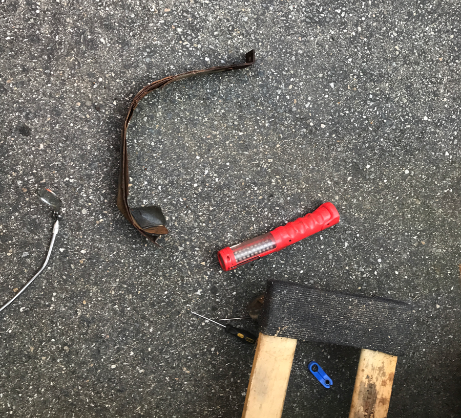 Rusty fuel tank strap.