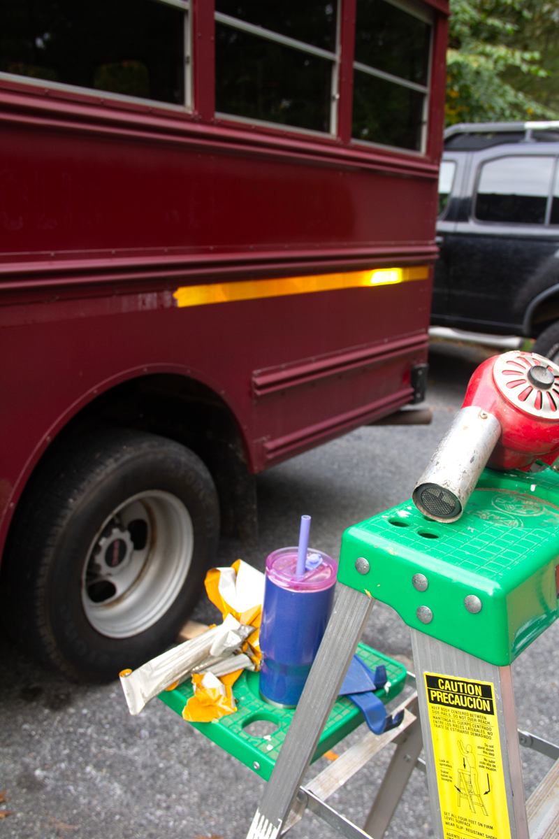 Paint removal tools on a ladder.